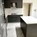 ﻿Spanish Laminate Wood Kitchen with Quartz Countertop