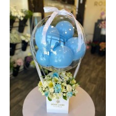 Flower arrangement with balloons