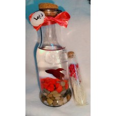 Fighter fish + tank + decorative plant and stones + a shell with a phrase of your choice written on it