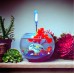 Fighter fish + tank + decorative plant and stones + a shell with a phrase of your choice written on it